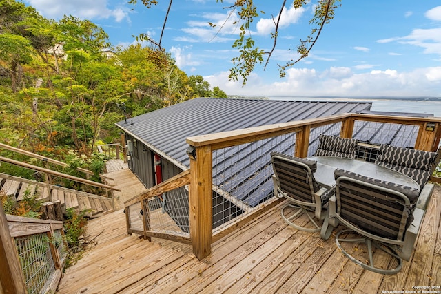 deck featuring a water view