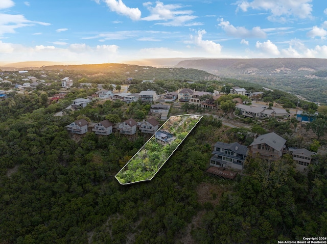 birds eye view of property with a mountain view