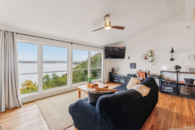 living room featuring lofted ceiling, light wood-type flooring, and ceiling fan