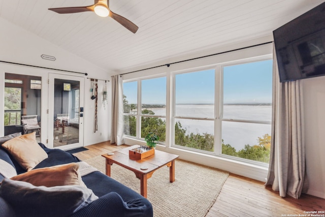 sunroom featuring ceiling fan and vaulted ceiling