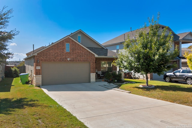 view of front of house with a front yard and a garage