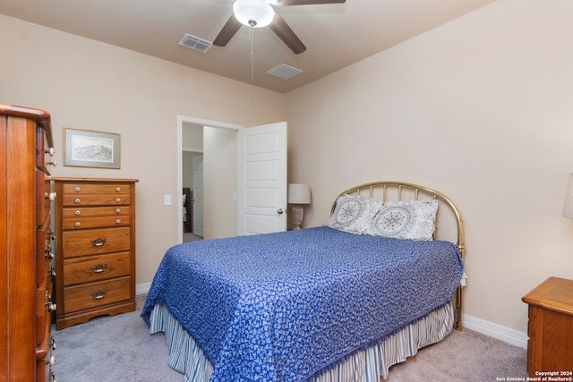 bedroom with light carpet and ceiling fan