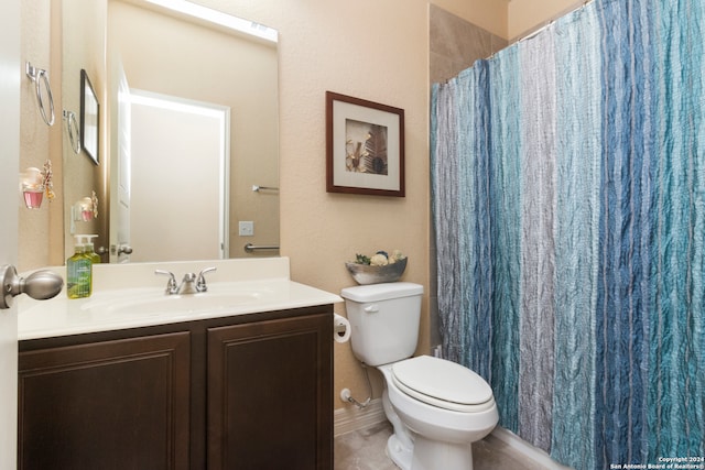 bathroom featuring vanity, a shower with shower curtain, and toilet