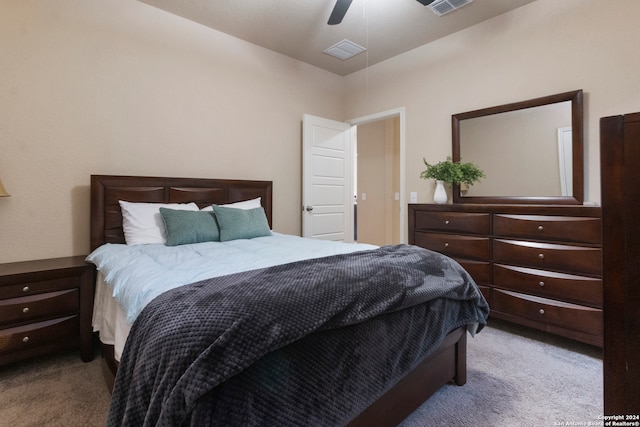 bedroom featuring light carpet and ceiling fan