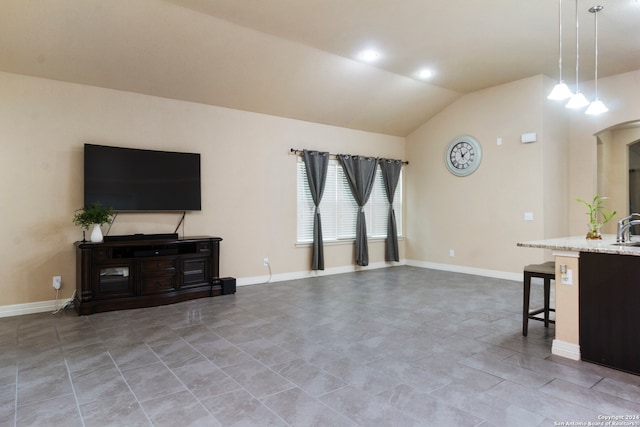 living room featuring light tile patterned floors and lofted ceiling