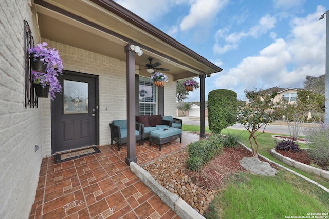 doorway to property with a porch and ceiling fan