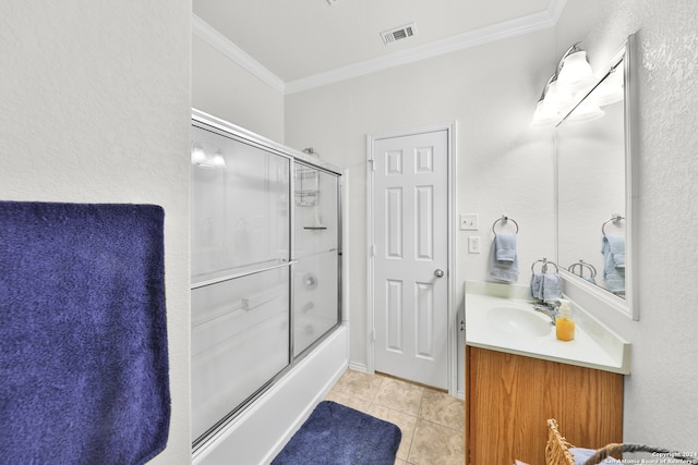 bathroom with vanity, crown molding, enclosed tub / shower combo, and tile patterned floors