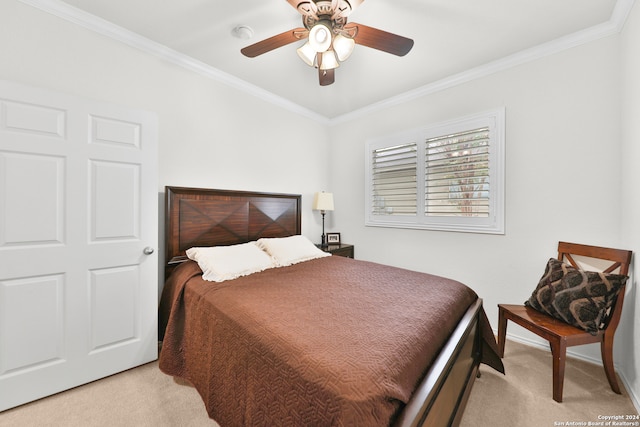 bedroom with light carpet, crown molding, and ceiling fan