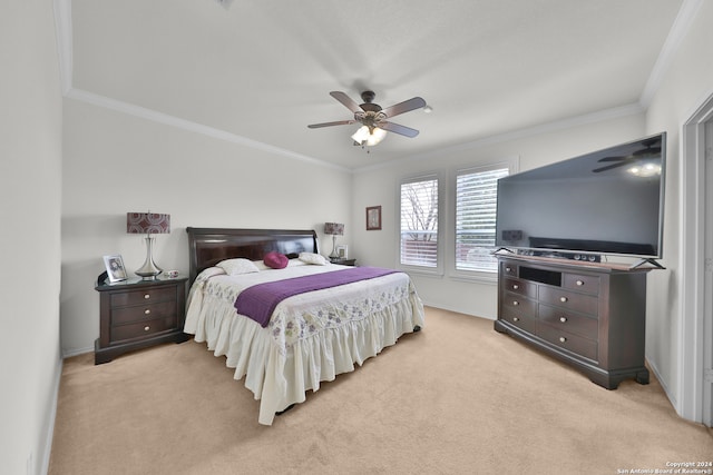 carpeted bedroom featuring crown molding and ceiling fan