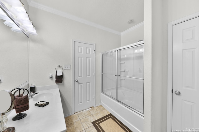 bathroom with vanity, enclosed tub / shower combo, tile patterned floors, and ornamental molding