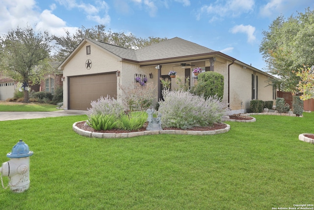 single story home featuring a front yard and a garage