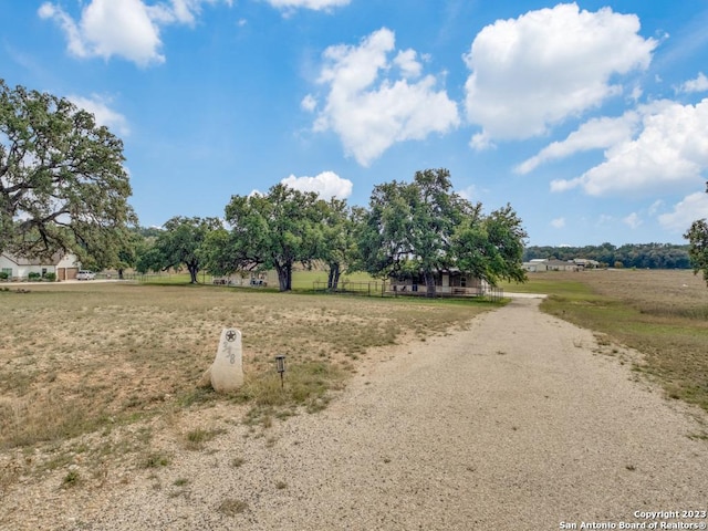 338 Salt Grass Trl, Bandera, TX 78003 - view of dirt / gravel driveway featuring a view of rural / pastoral area