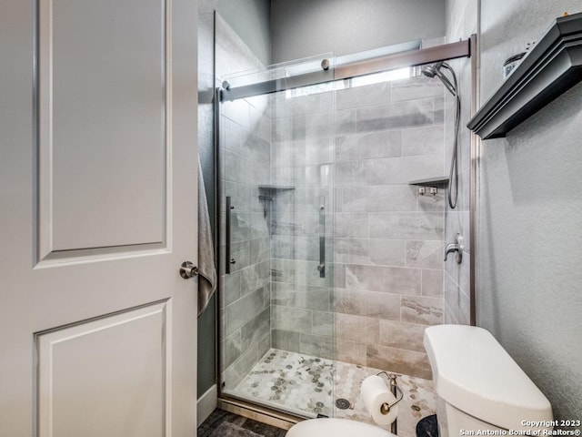 338 Salt Grass Trl, Bandera, TX 78003 - bathroom with toilet and a shower stall