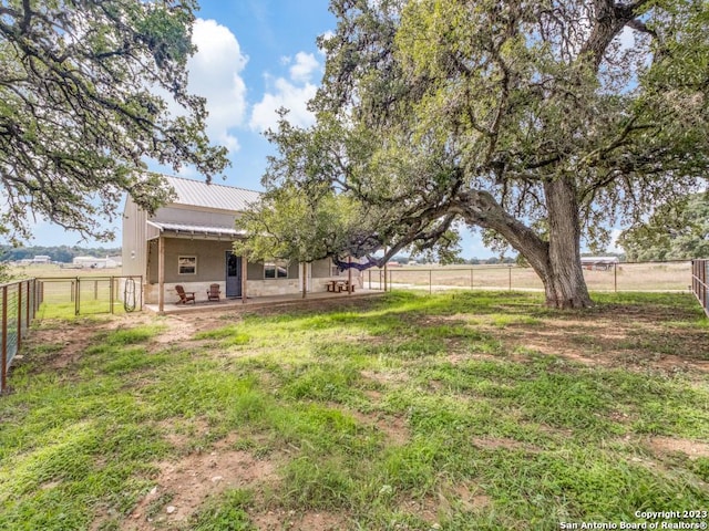 338 Salt Grass Trl, Bandera, TX 78003 - fenced backyard with a patio