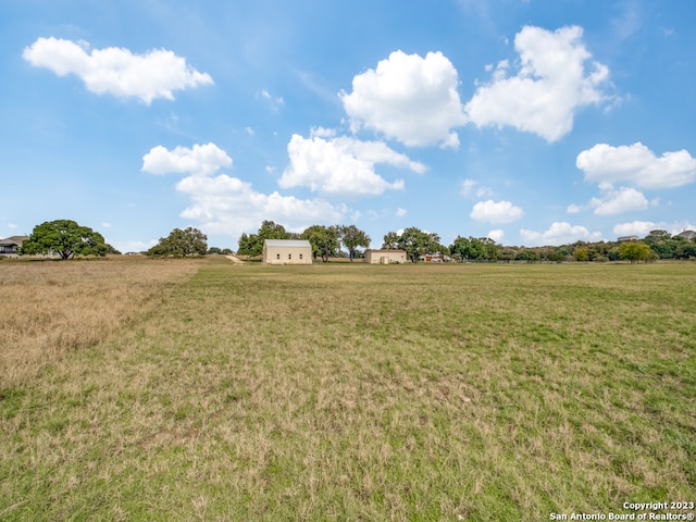 view of yard with a rural view