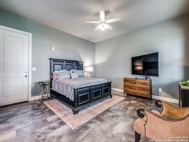 bedroom featuring ceiling fan and dark hardwood / wood-style floors