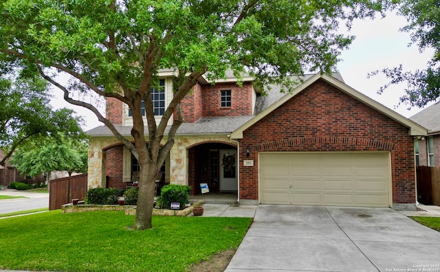 view of front of house with a garage and a front lawn