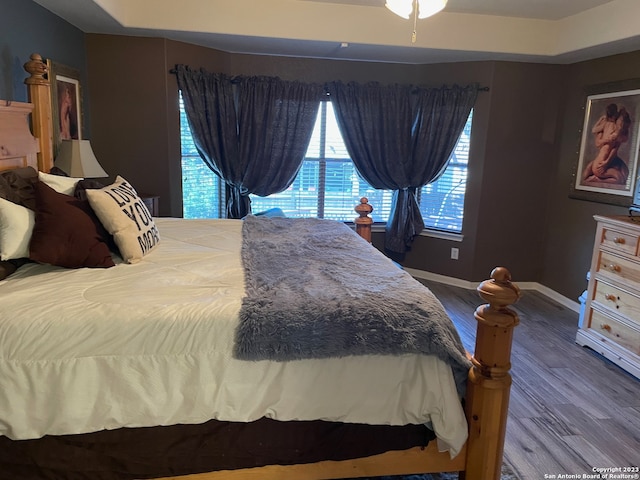 bedroom with hardwood / wood-style flooring