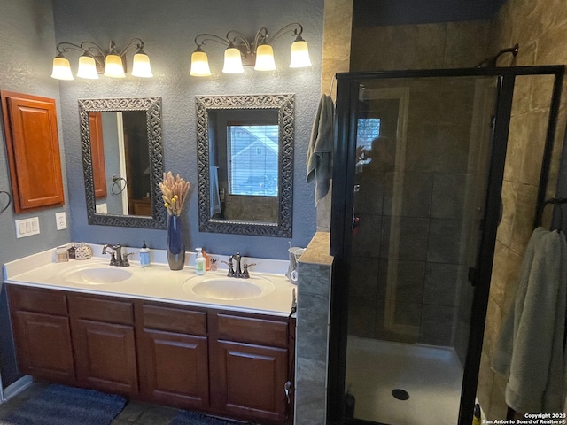 bathroom featuring vanity and a shower with shower door