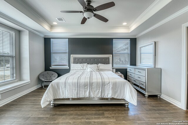 bedroom featuring ornamental molding, dark hardwood / wood-style floors, and ceiling fan