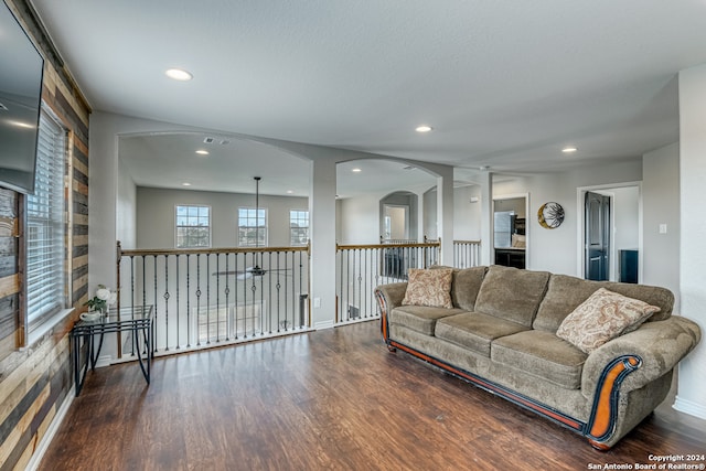 living room with dark hardwood / wood-style flooring