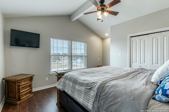 bedroom with dark wood-type flooring, ceiling fan, a closet, and lofted ceiling with beams