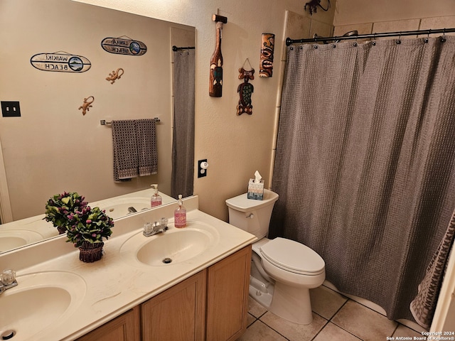 bathroom with walk in shower, vanity, toilet, and tile patterned floors