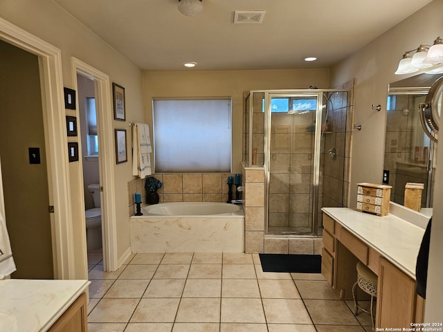 full bathroom with vanity, toilet, shower with separate bathtub, and tile patterned flooring