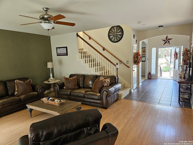 living room featuring ceiling fan and wood-type flooring