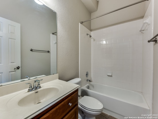 full bathroom with tiled shower / bath combo, vanity, and toilet