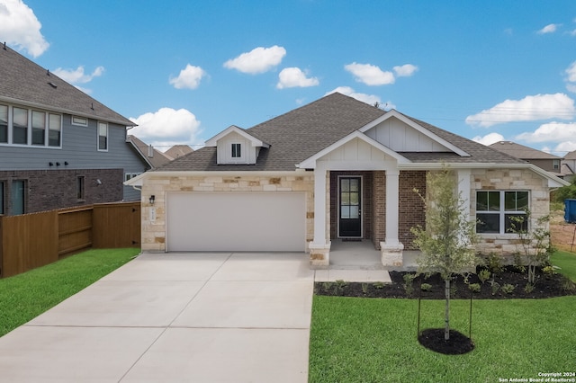 view of front of house with a front lawn and a garage