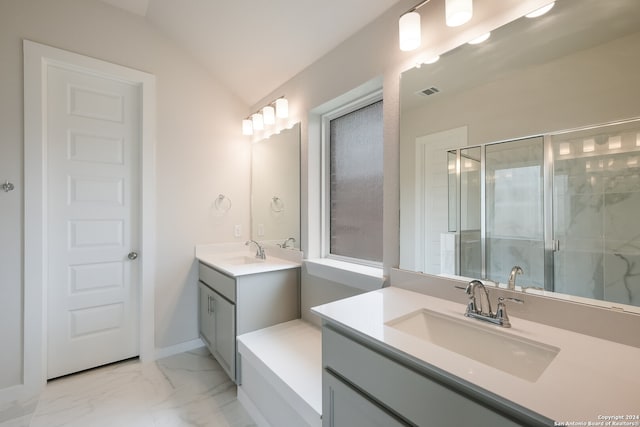 bathroom with a shower with door, vaulted ceiling, and vanity