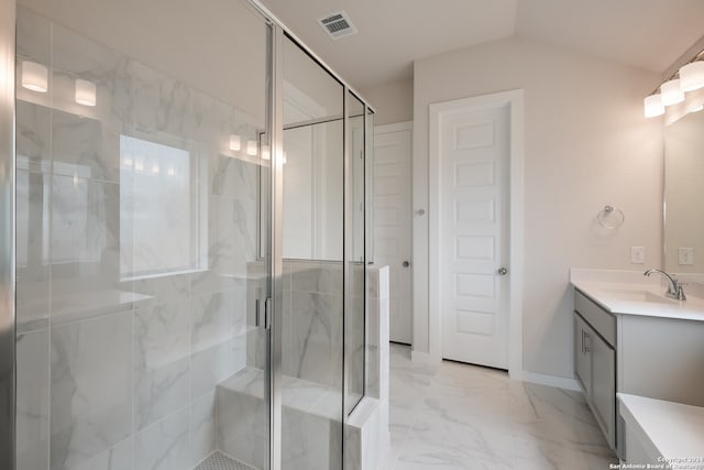 bathroom featuring vanity, lofted ceiling, and an enclosed shower