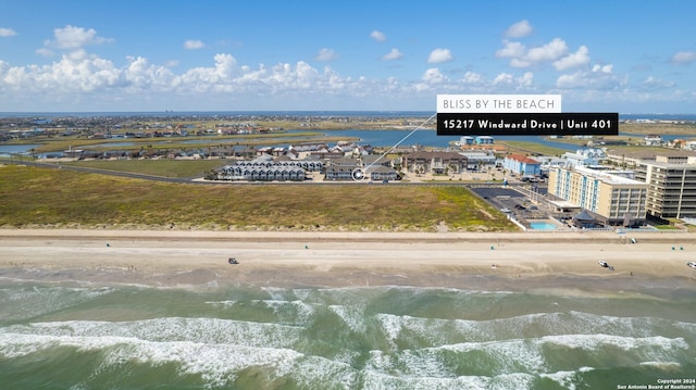 aerial view featuring a view of the beach and a water view