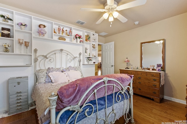 bedroom featuring hardwood / wood-style flooring and ceiling fan