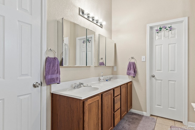 bathroom with vanity and tile patterned floors