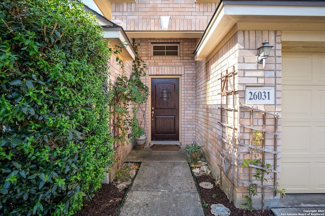 doorway to property featuring a garage