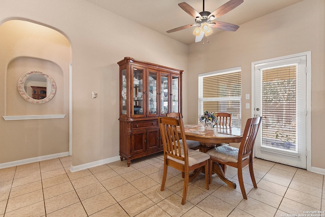 dining room with light tile patterned floors and ceiling fan