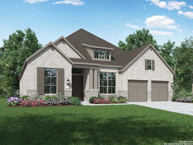 view of front of house featuring a garage and a front yard