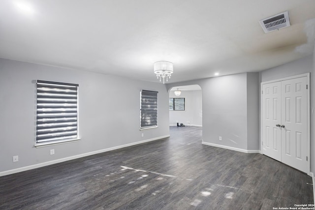 spare room with dark hardwood / wood-style floors