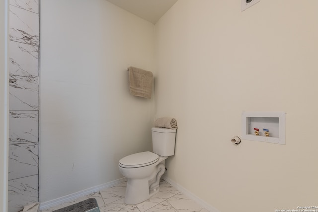 bathroom featuring toilet