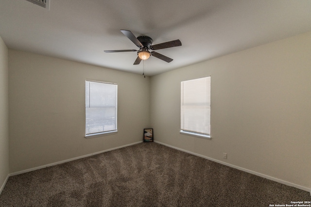 empty room featuring carpet flooring and ceiling fan