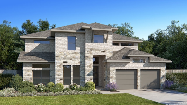 prairie-style home featuring a front yard and a garage