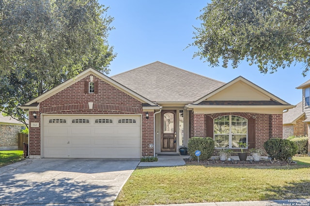 view of front facade featuring a front yard and a garage