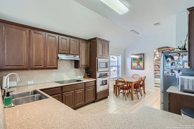 kitchen with sink, appliances with stainless steel finishes, backsplash, and light tile patterned floors