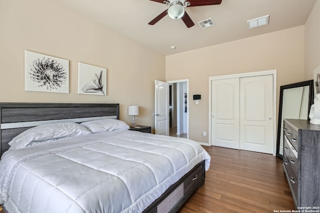 bedroom featuring a closet, ceiling fan, and dark wood-type flooring