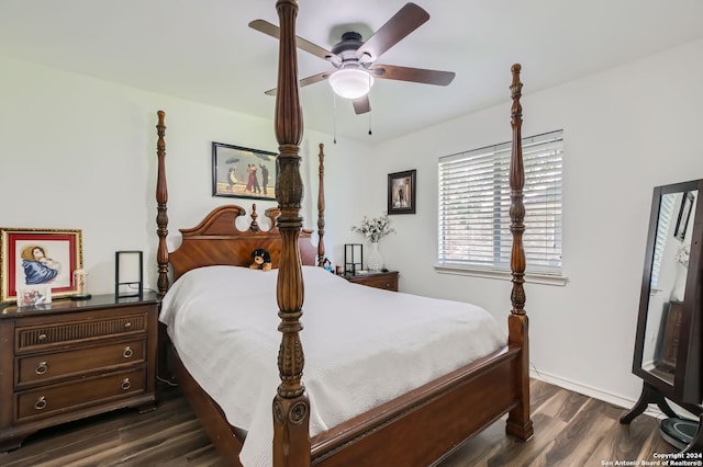 bedroom with ceiling fan and dark hardwood / wood-style flooring