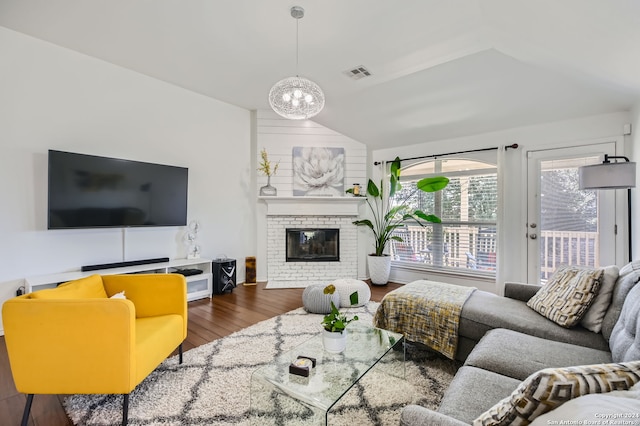 living room with dark wood-type flooring and a fireplace