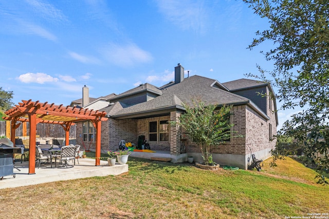 back of property featuring a yard, a patio, and a pergola