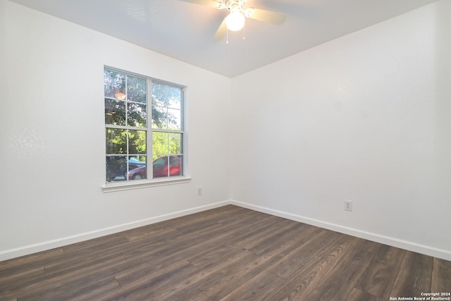 empty room featuring ceiling fan and dark hardwood / wood-style flooring